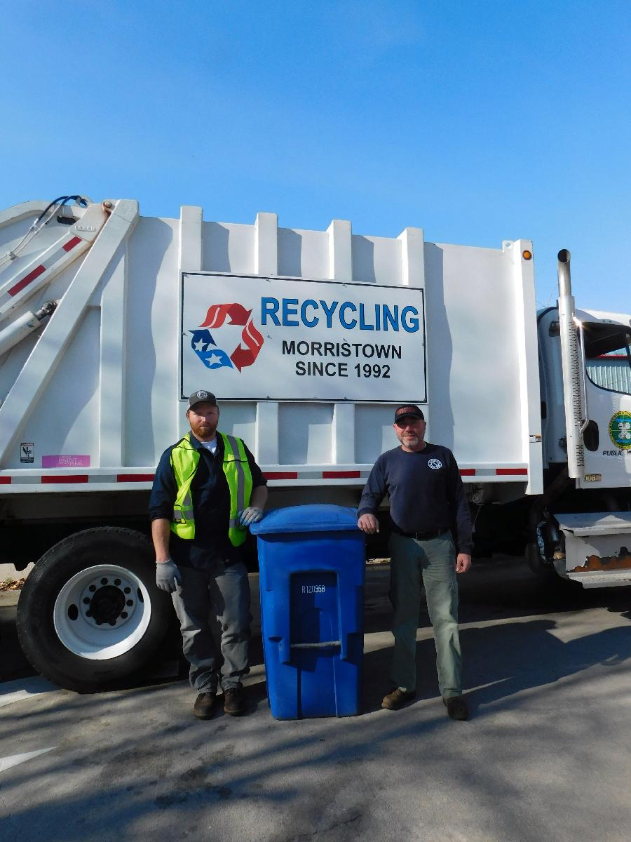 Men with recycling can